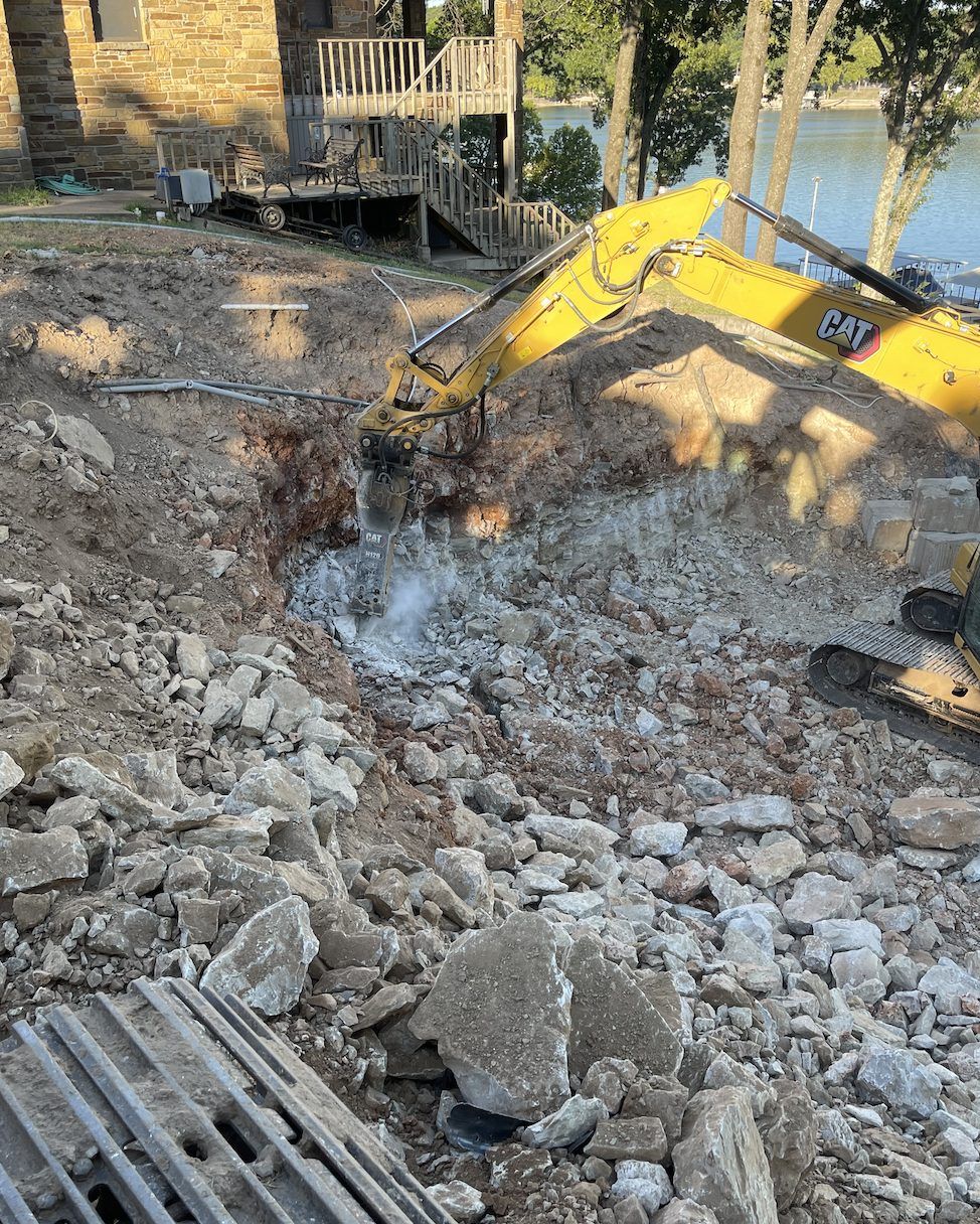 Concrete slab broken out with a hydraulic hammer