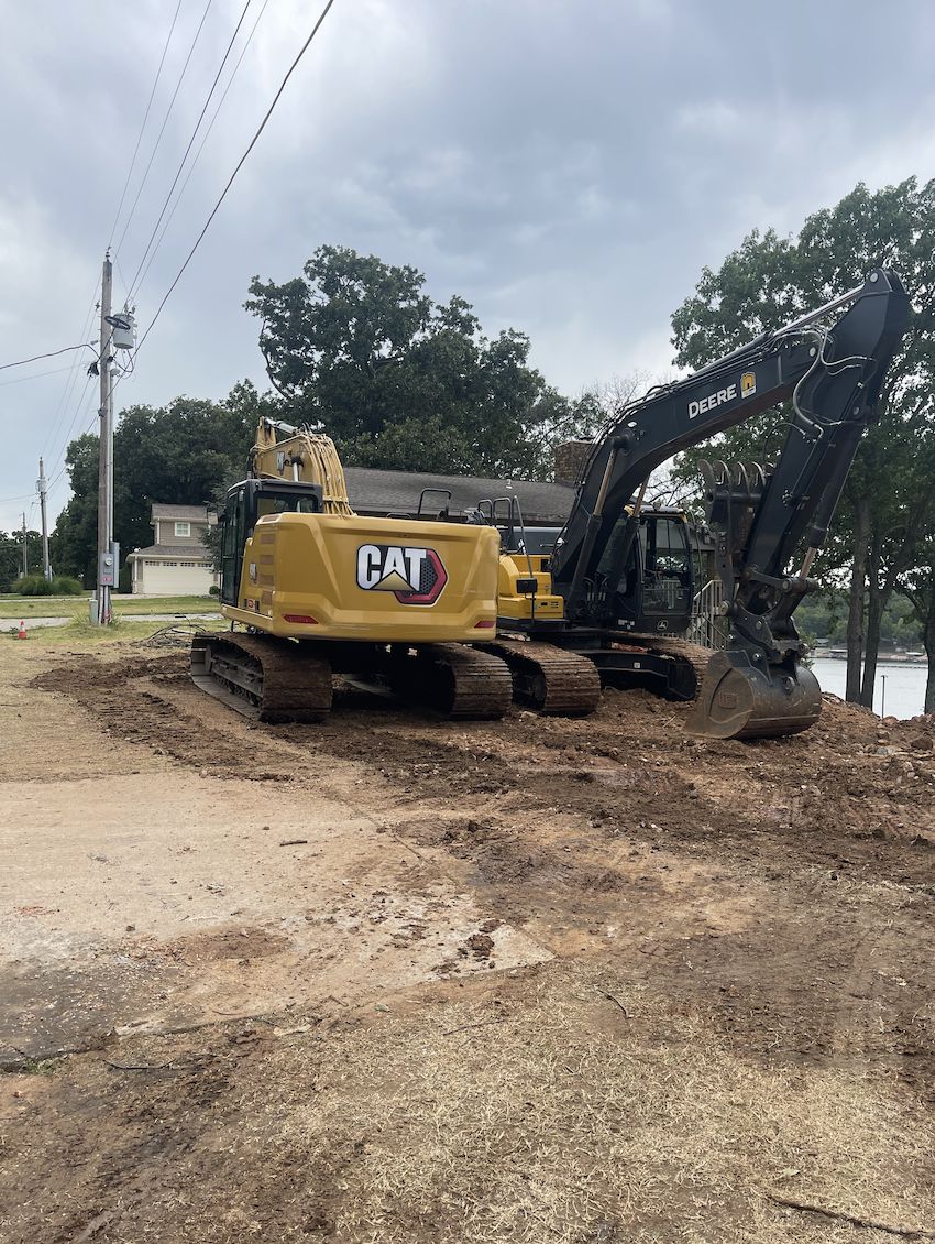 Tracked excavator on a private drive